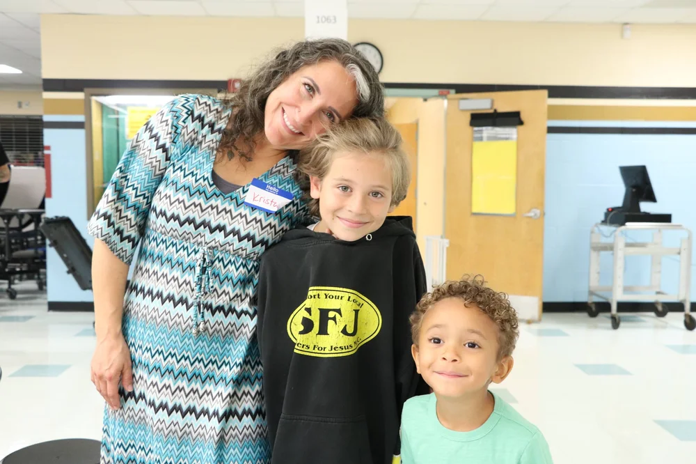 A mother and children together at an Orangetree community gathering